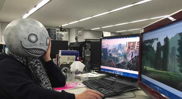 Director Taro Yoko at his desk, wearing his infamous mask