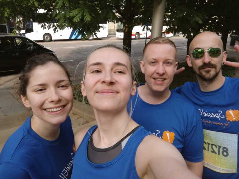 A photograph of 4 runners before their race starts.